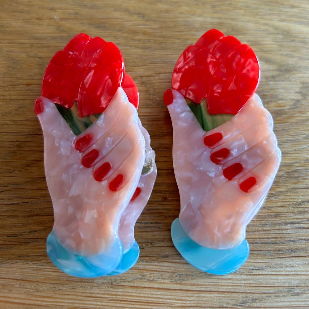 Set Hand holding a rose hair clip. Claw Clip 3.5 in, Acetate. Hair Accessory/New